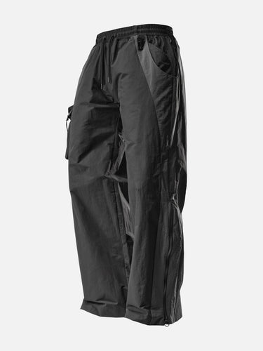 Black W2 Trackpants, 45-degree bent-leg side view