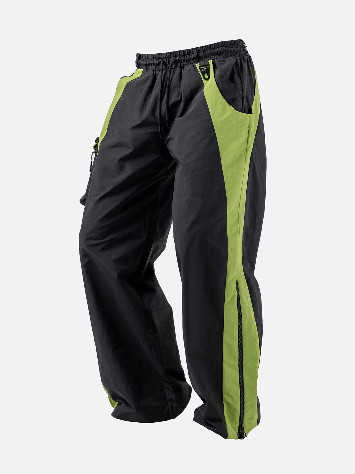 Black with green side panel track pants, featuring a decorative buckle at the waist, and a zip-up expandable seam to hem.