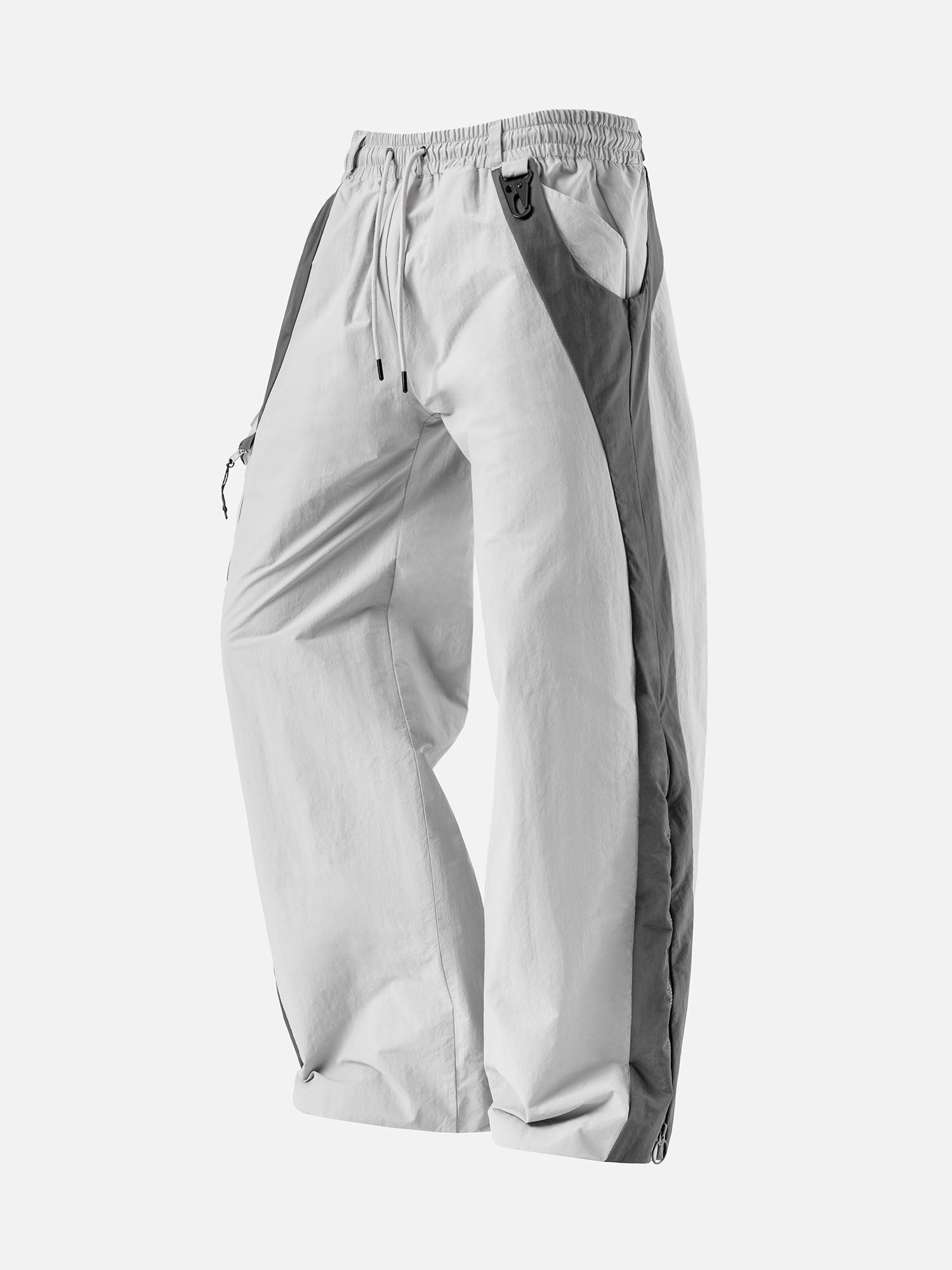 Light grey with grey side panels track pants, featuring a decorative buckle at the waist, and a zip-up expandable seam to hem.
