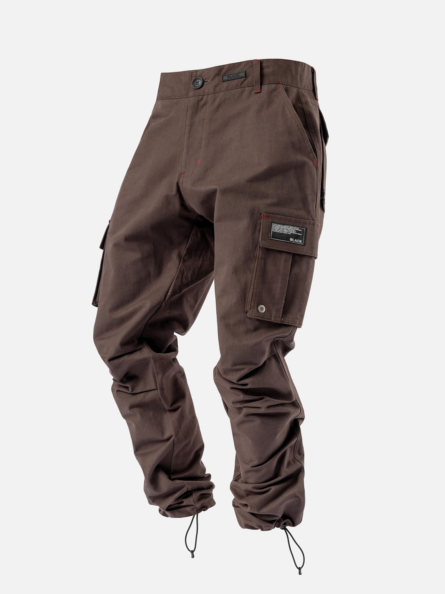 Bark cargo pants with red stitching, side pockets, and ankle drawstrings, with a modern streetwear look.