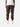 Bark cargo pants with side pockets, ankle drawstrings, paired with a white t-shirt, and white sneakers, showcasing streetwear style.