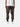 Back view of bark cargo pants with side pockets, ankle drawstrings, and simple back pockets, paired with a white t-shirt, and white sneakers.