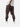 Back view of bark cargo pants showcasing simple back pockets, with side pockets, ankle drawstrings, paired with a white t-shirt, and white sneakers.