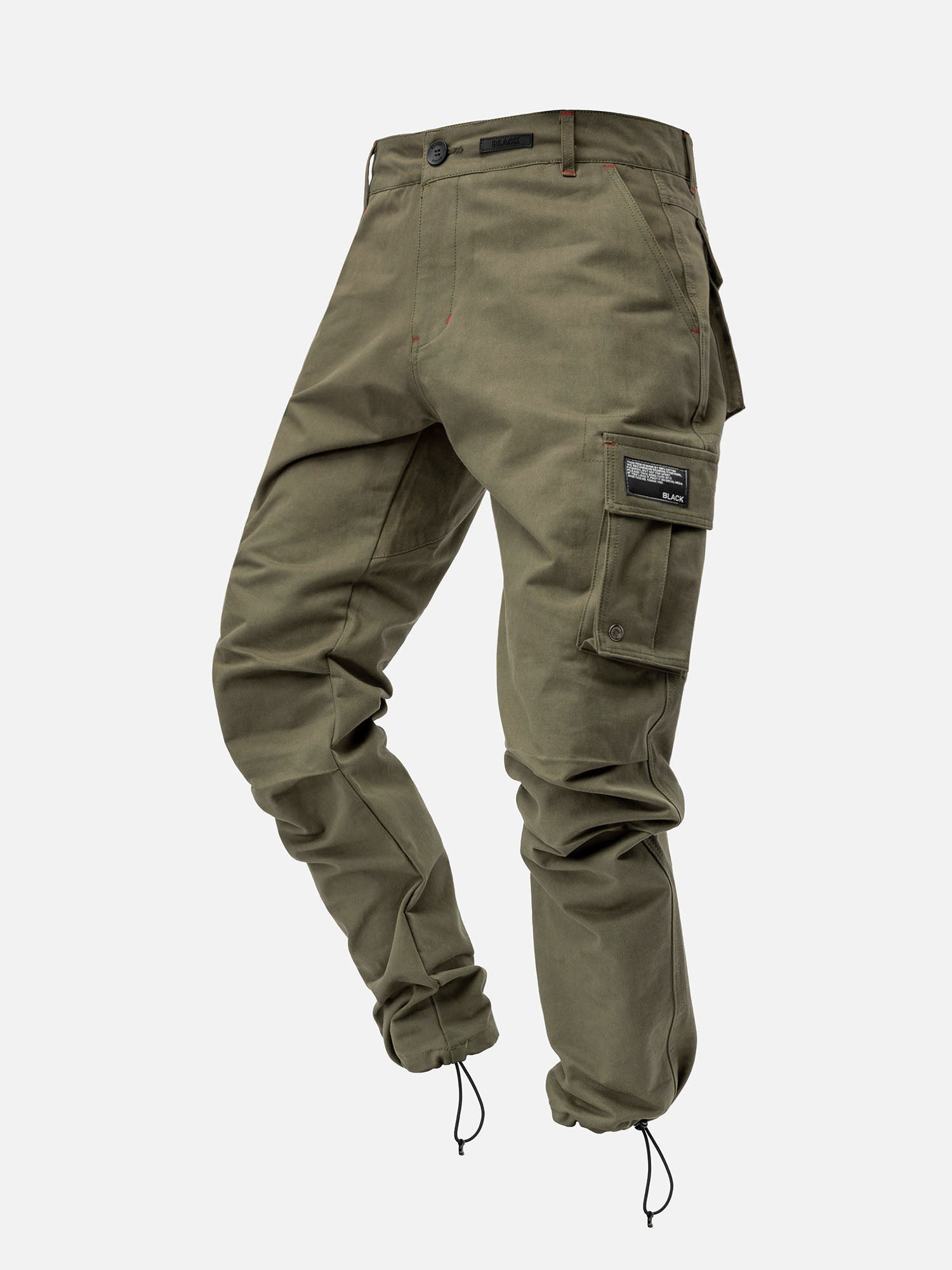 Forest cargo pants with red stitching, side pockets, and ankle drawstrings, with a modern streetwear look.