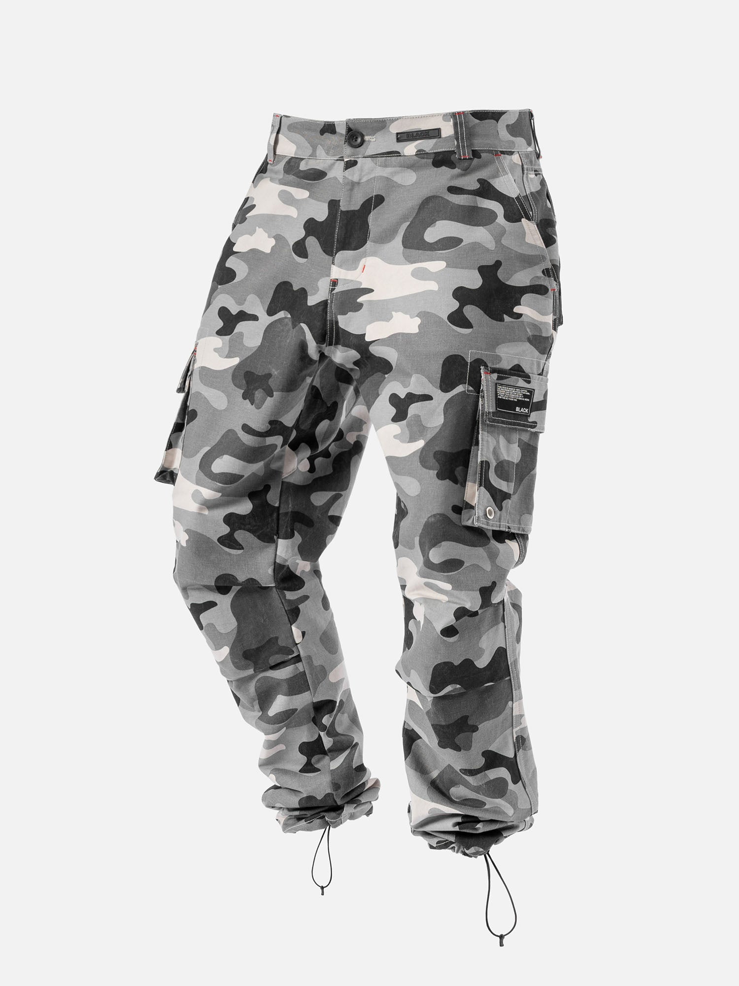 Grey camo cargo pants with red stitching, side pockets, and ankle drawstrings, with a modern streetwear look.