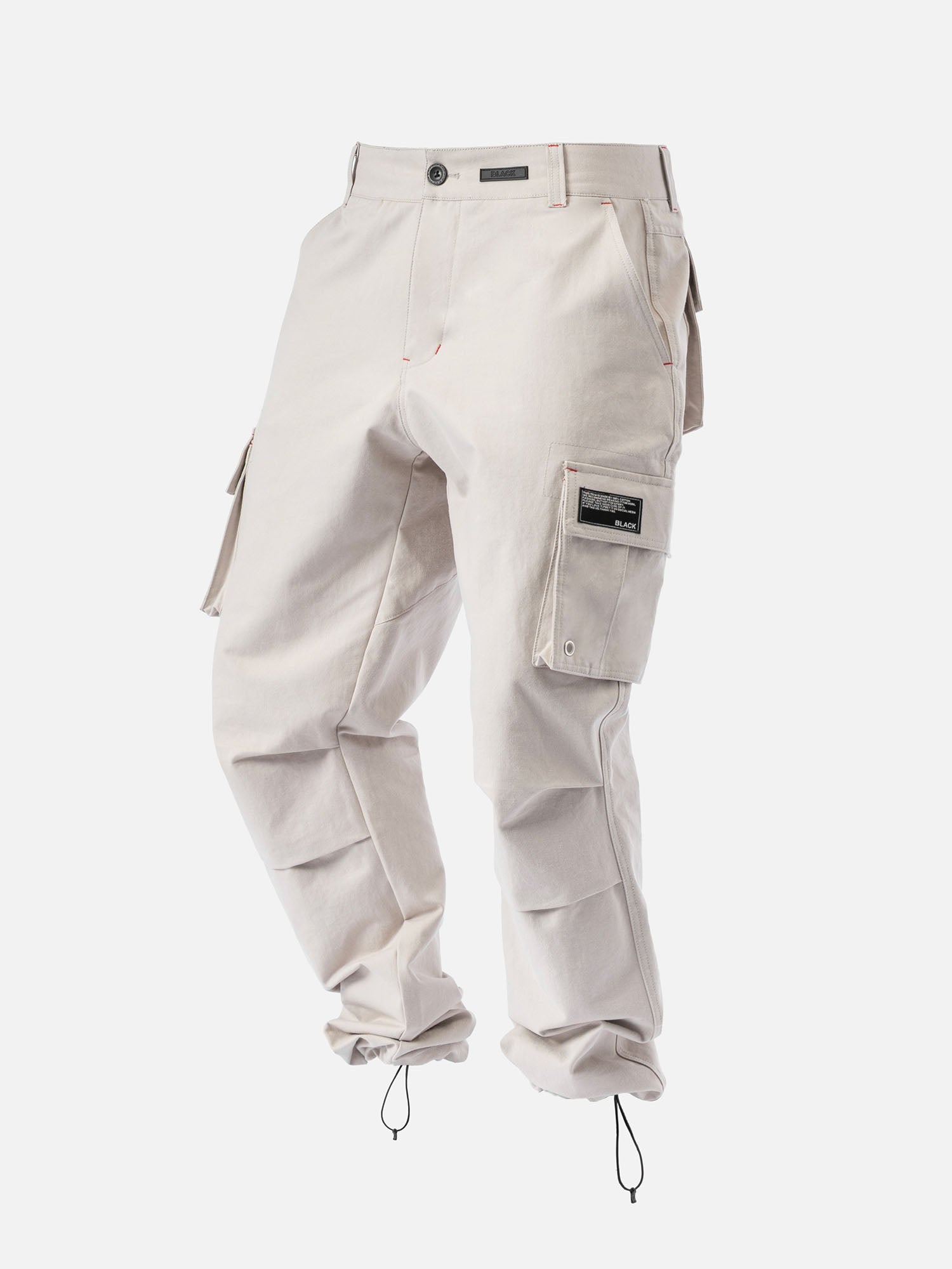 Rock cargo pants with red stitching, side pockets, and ankle drawstrings, with a modern streetwear look.