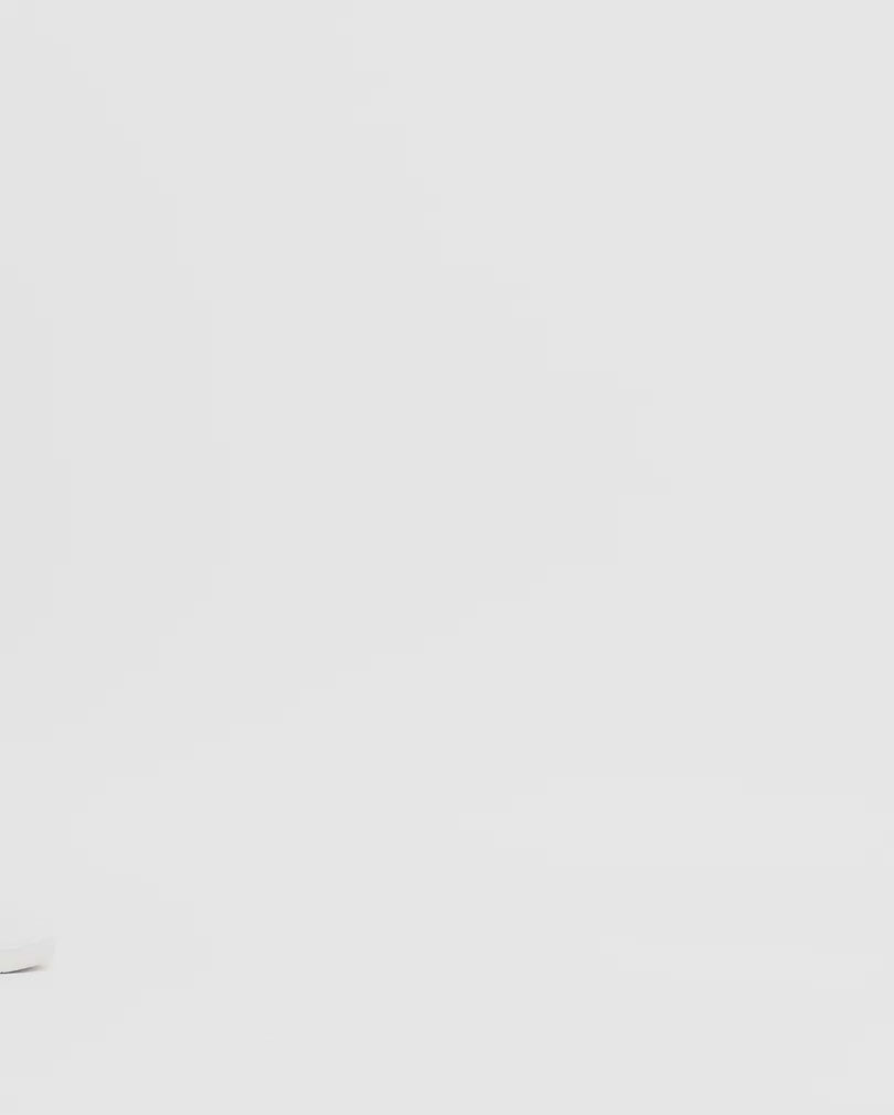 Video of grey camo cargo showing the  side pockets and ankle drawstrings.