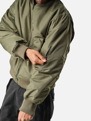 Green Reverse Bomber, casual half-body pose on model
